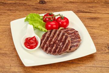 Grilled burger cutlet with sauce