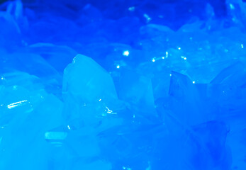 Macrophotography of blue transparent crystals of copper sulfate. Crystal surface texture.