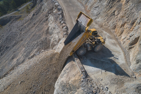 Mining Dumper unloading from aerial view