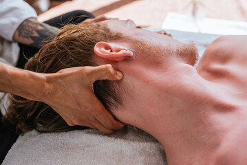 Naklejka premium Man Receiving Relaxing Neck Massage