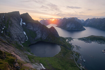 July midnight sun in the sky over Kirkejord from Reinebringen, Moskenes√∏y, Lofoten Islands, Norway