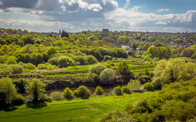Fototapeta premium A view from the Conisbrough Viaduct across the River Don towards Conisbrough, Yorkshire, UK in springtime