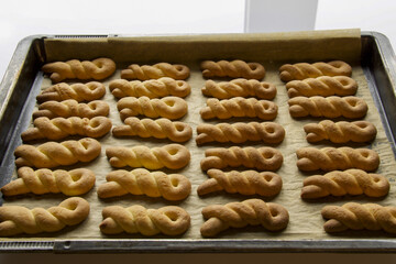 large group of homemade biscuits intertwined
