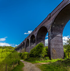 Fototapeta na wymiar A view below the Conisbrough Viaduct in Conisbrough, Yorkshire, UK in springtime