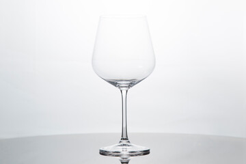 Glass goblet on a white background. Utensils for wine.