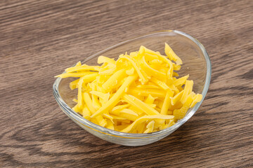 Shredded yellow cheese in the bowl