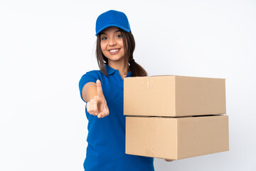 Young delivery brunette girl over isolated white background showing and lifting a finger