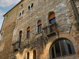 Brick facade of a historic building in Italy