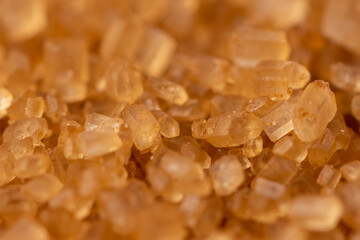Close-up of brown cane sugar texture. Sweetness