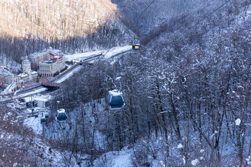 Lift cabins in a mountain ski resort  snowy slope  in a  winter