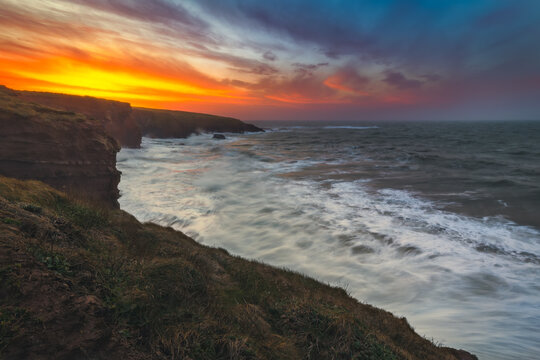 Copper Coast, Waterford, Ireland. coastline with colorful explosive sunset