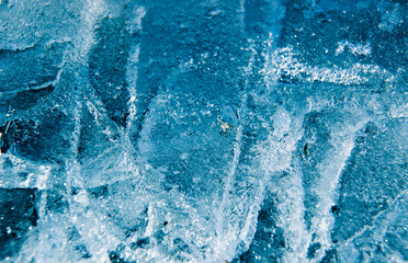 Beautiful winter background. The texture of the ice, soft focus.Texture ice with cracks. Frosty pattern. Abstract ice background. Winter wonderland. Winter background for Christmas card.