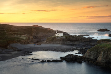 Spectacular coastal landscape with a solitary hermitage located on the cliffs. Hermitage of Virxe do Porto, Valdoviño, Galicia, Spain