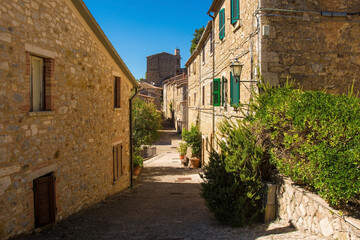 Fototapeta na wymiar A street in the historic medieval village of Rocchette di Fazio near Semproniano in Grosseto Province, Tuscany, Italy 