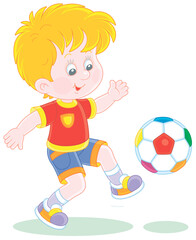 Little football player kicking a colorful ball at a match or training on a sports field, vector cartoon illustration isolated on a white background