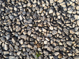 Natural stone pebble material texture background. stone background, dark gravel pebbles stone