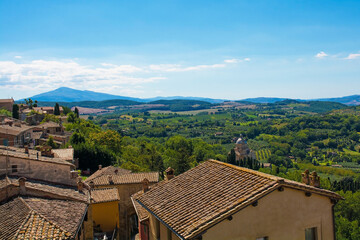 The late summer landscape around Montepulciano in Val d'Orcia, Siena Province, Tuscany, Italy. Seen from above the town's rooftops
