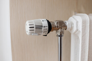 Thermostat on heating cast iron radiator adjust temperature