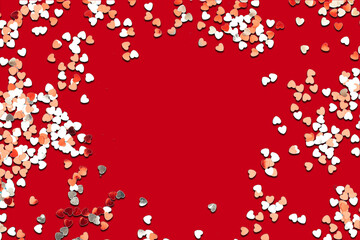 Fototapeta na wymiar red and white heart shape confetti on red background. valentine's day concept