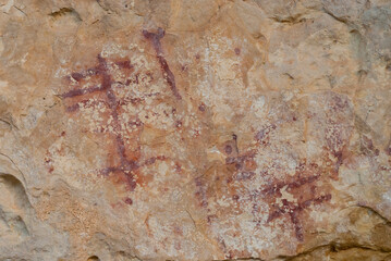 Red rock paintings in the lapel of the eagle on limestone rock in the gorges of the duraton dated to the bronze age