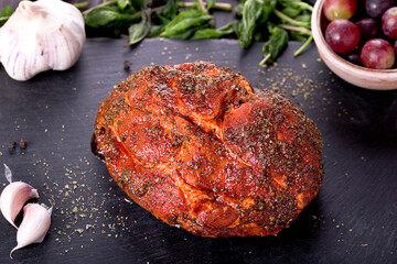 roast with herbs on a black stone © Patrycja