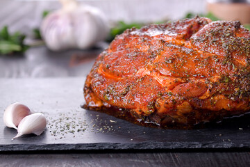 roast with herbs on a black stone © Patrycja