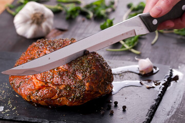 roast with herbs on a black stone © Patrycja
