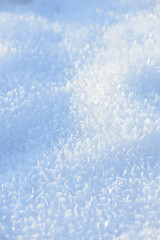 Hoarfrost background texture. Fresh ice and snow winter backdrop with snowflakes and mounds. Seasonal wallpaper. Frozen water geometrical shapes and figures. Cold weather atmospheric precipitation.