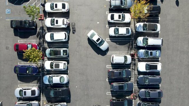 Aerial top view of parking lot with many cars from above, city transportation and urban concept 