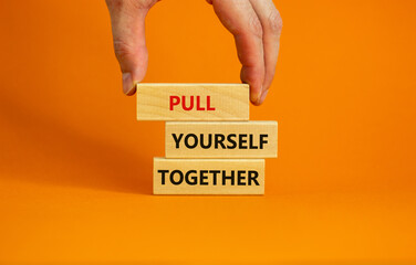 Pull yourself together symbol. Wooden blocks with words 'Pull yourself together'. Beautiful orange background. Copy space. Business, motivational and pull yourself together concept.