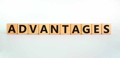 Advantages symbol. Concept word 'advantages' on wooden cubes on a beautiful white background. Business and advantages concept, copy space.