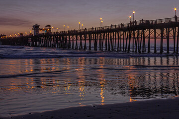 The soothing colors of dusk and gently lapping surf along the beach encourage visitors to the...