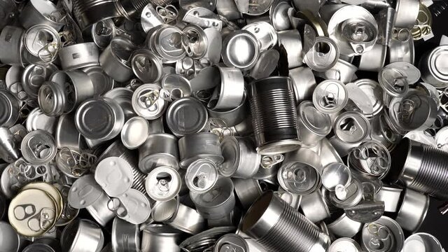 Large amount of metal tins, cans and jars for recycling. Aluminum metal food and drink sorted scraps. Steel packaging. Zero waste and recycle of domestic waste at home concept. No pollution.