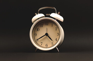 Alarm clock on black background isolated photo