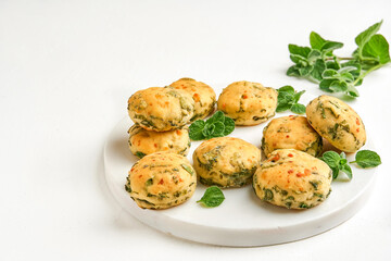 Homemade buns with fresh herbs and cheese. Top view with copy