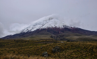Fototapeta premium The Cotopaxi volcano in the clouds, Cotopaxi National Park, Ecuador