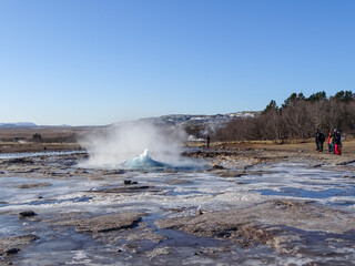 Strokkur geyser in Iceland, during winter road trip.