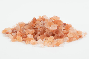 Fototapeta na wymiar Pink himalayan salt on a white background with visible details