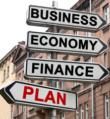 The road indicator on the arrows of which is written - business, economics, finance and PLAN