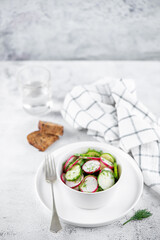 Radish cucumber dill salad in a bowl