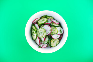 Radish cucumber dill salad in a bowl