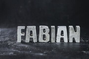 Fototapeta premium Fabian, Name Betonbuchstaben
