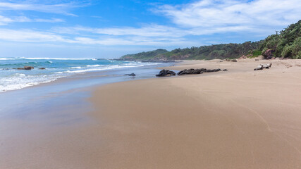 Fototapeta na wymiar Beach Sand Ocean Waters Edge Walking Perspective Landscape
