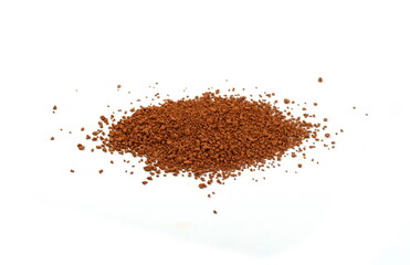 Pile of Red dirt (soil) on white. Heap of Red dry clay isolated on white background. Ochre, also...