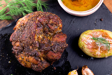 roast with herbs on a black stone © Patrycja