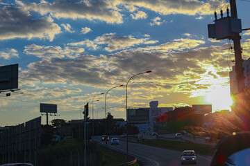 City, sunset, cars and road