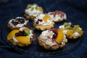 dessert with cream and fruit in tartlets