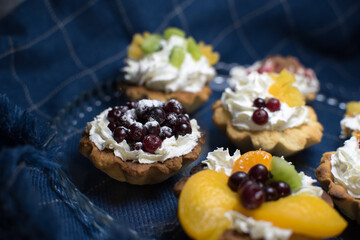 dessert with cream and fruit in tartlets