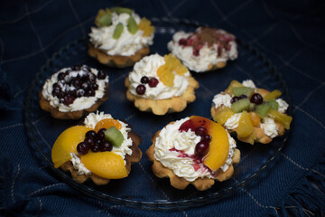 dessert with cream and fruit in tartlets