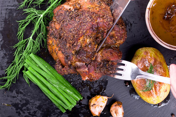  roast with herbs on a black stone © Patrycja